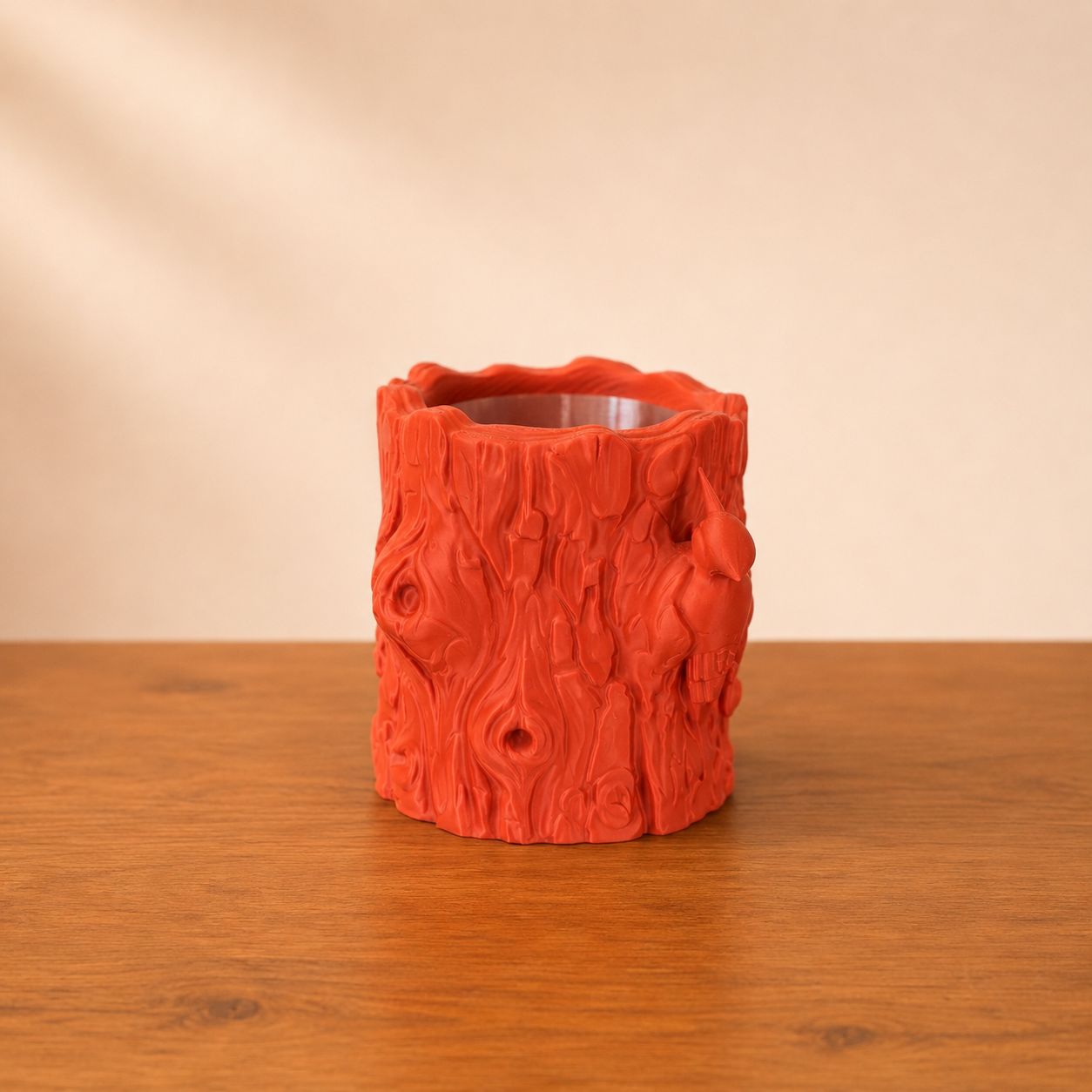 Nature inspired log planter showcasing detailed bark textures and handcrafted bird accents from the back view.
