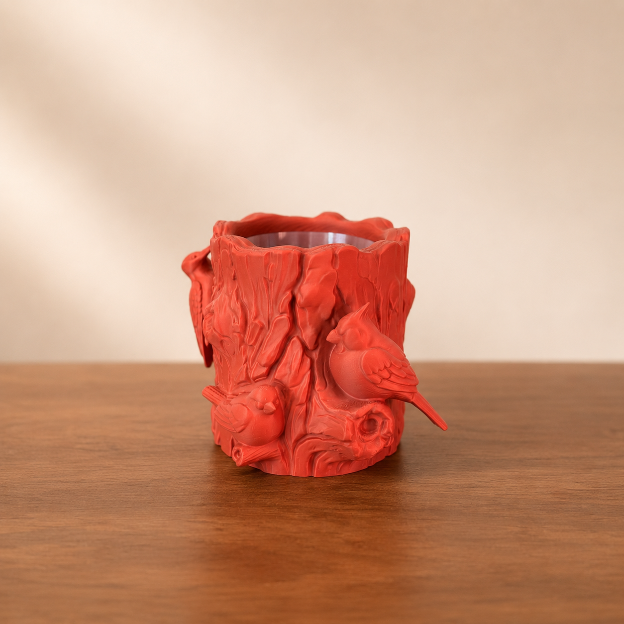 Feathered Forest Log Planter with detailed tree bark texture and perched bird accents, shown as a decorative woodland planter.