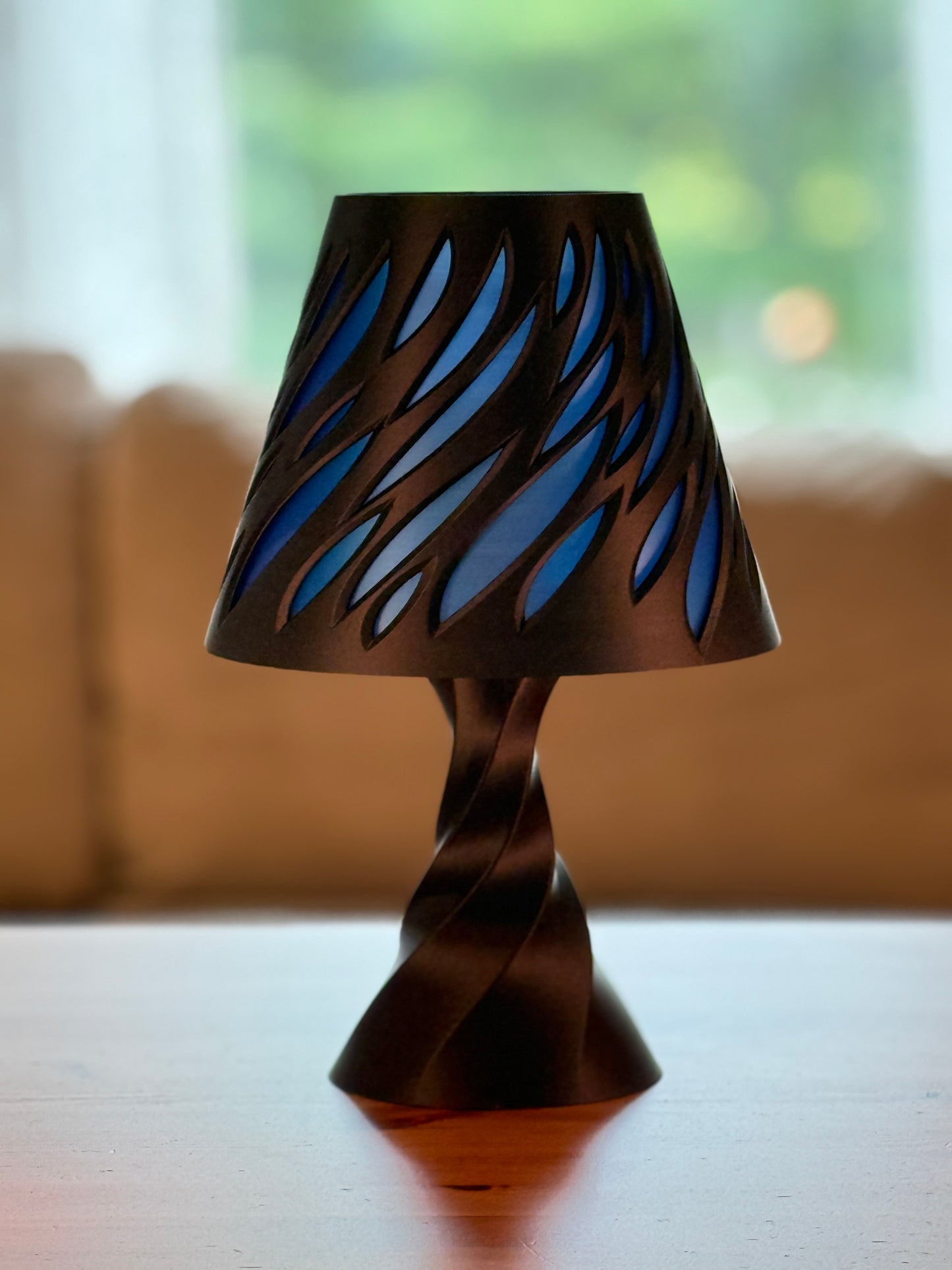 Tall Spectra Lamp showcasing futuristic sculptural form with ambient lighting