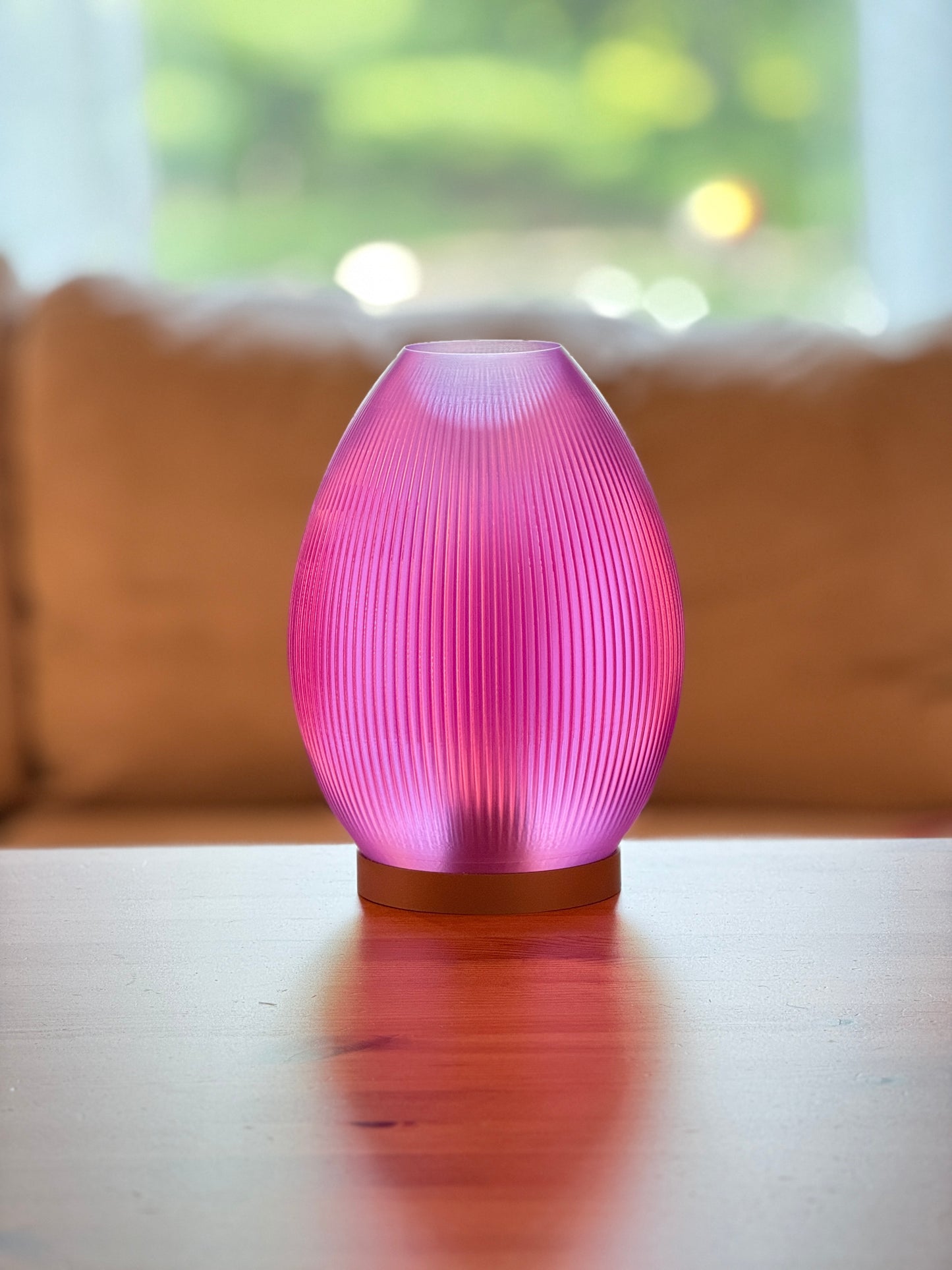 Modern flame-inspired lampshade diffusing soft warm light