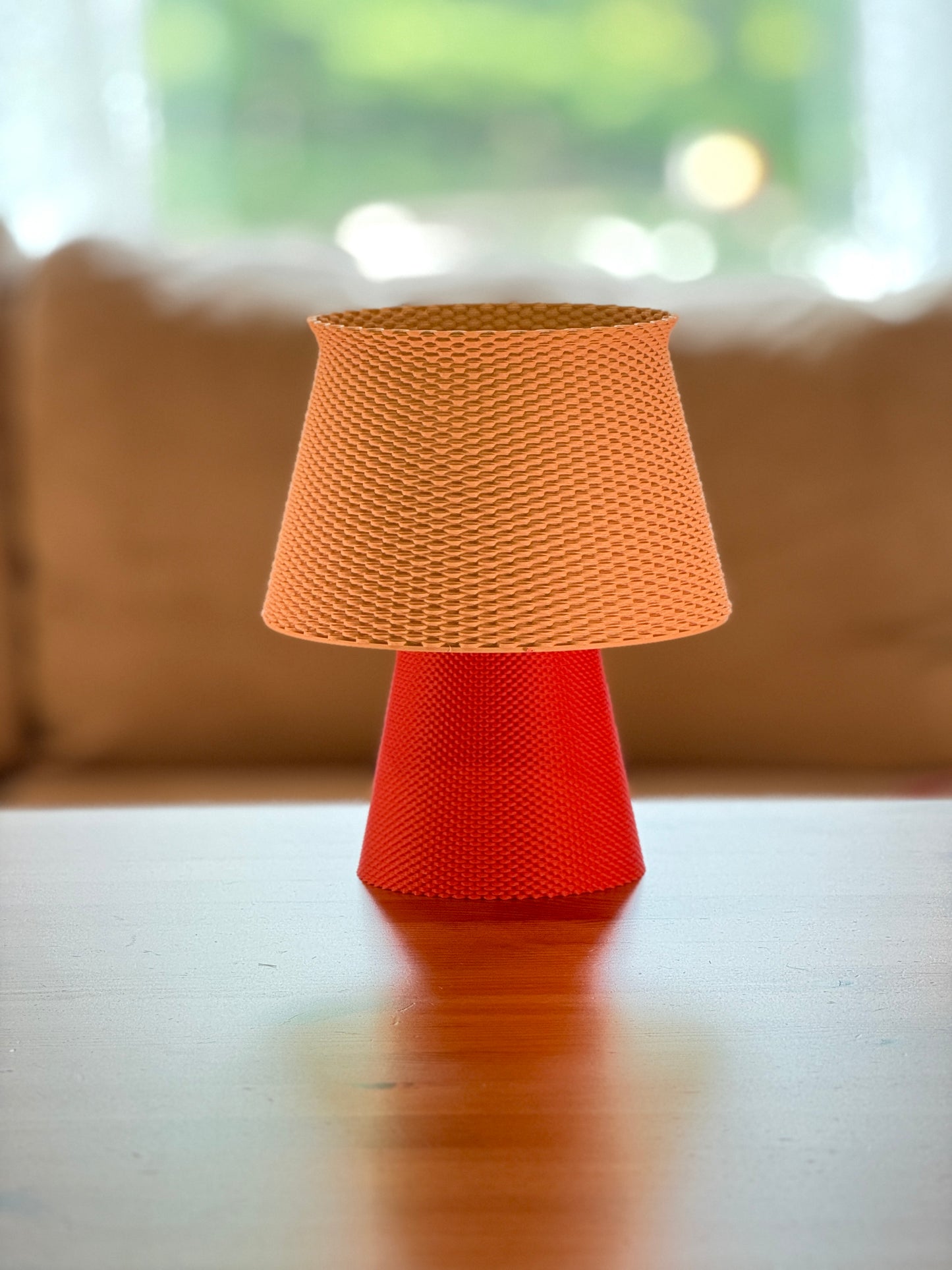 Modern Bruno Ripplemesh table lamp featuring a sculptural ripple pattern.