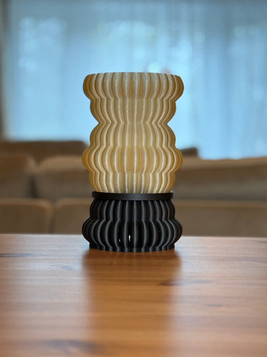 Leña Lamp with sculptural wood-inspired design emitting warm ambient light