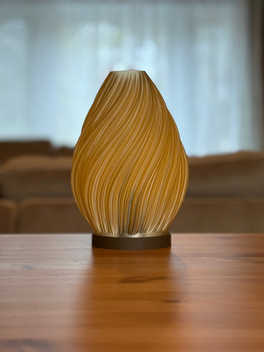 Spiral Flame Lamp featuring flowing sculptural spiral design