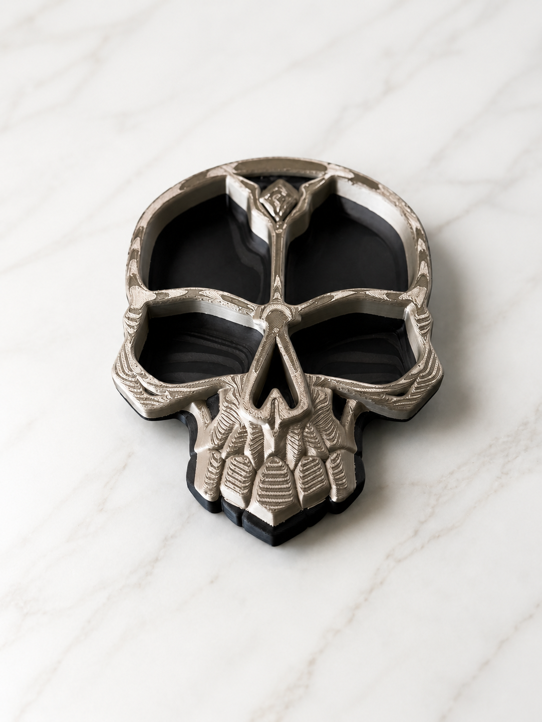Decorative skull tray with detailed gothic skull design and divided compartments for keys, jewelry, coins, and small accessories.