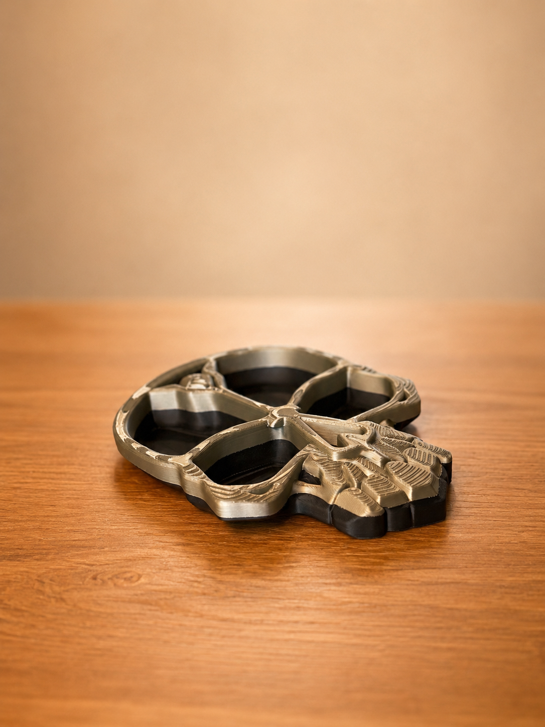 Black skull tray with detailed gothic texture and multiple storage compartments for jewelry, keys, coins, and everyday essentials.
