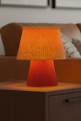 Bruno Table Lamp with ripplemesh texture creating soft ambient lighting.