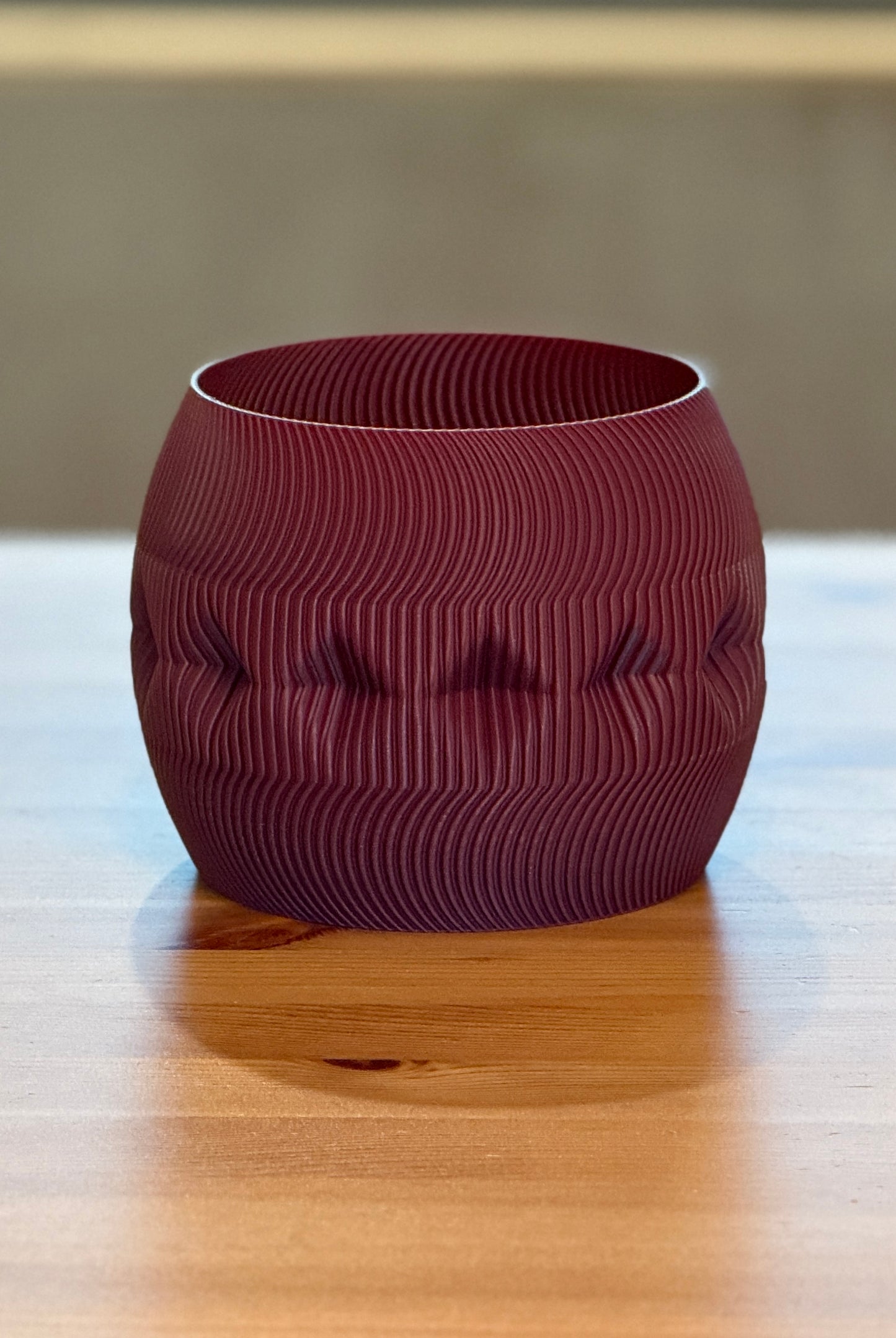 Contemporary Firkle planter featuring smooth curves and a bold 3D-printed form.