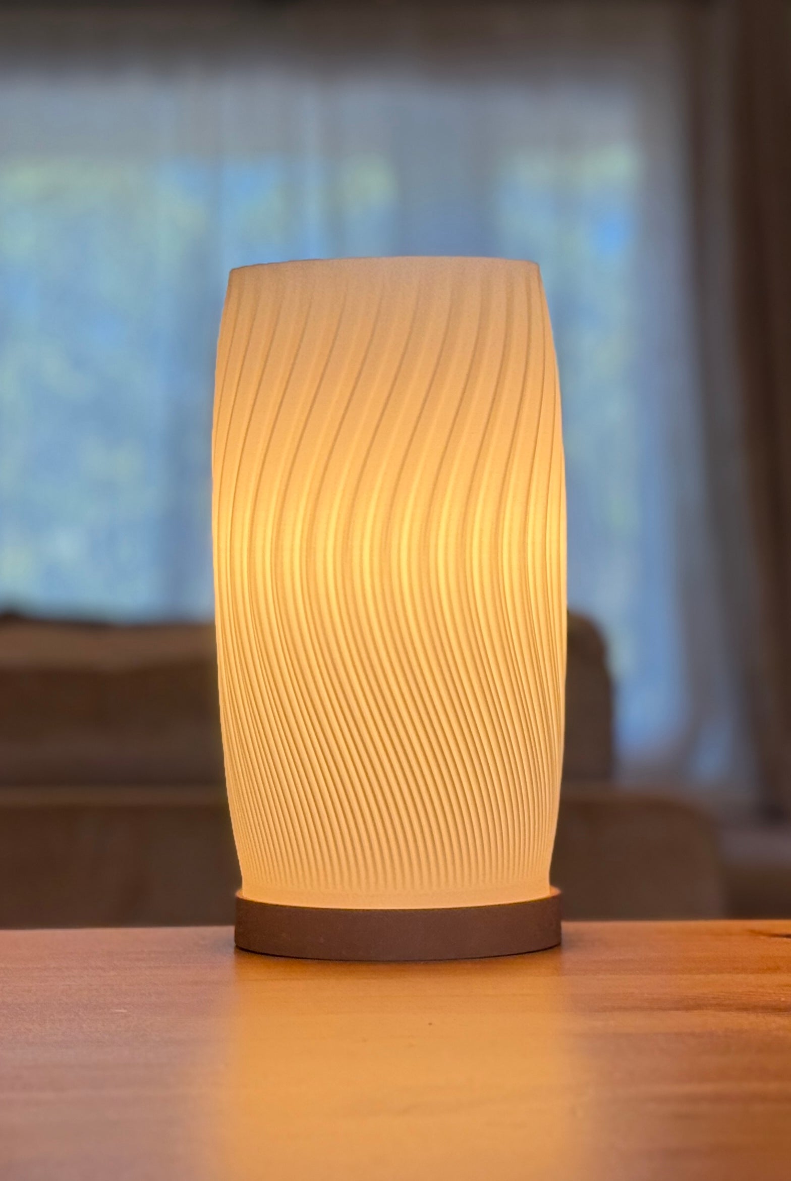 Flow Curve Lamp displayed as a contemporary sculptural table lamp