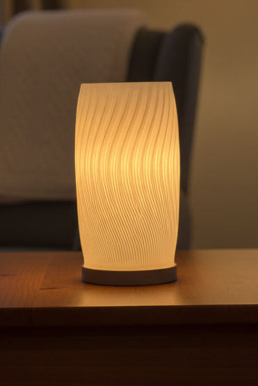 Flow Curve Lamp with sculptural curved design emitting a soft ambient glow