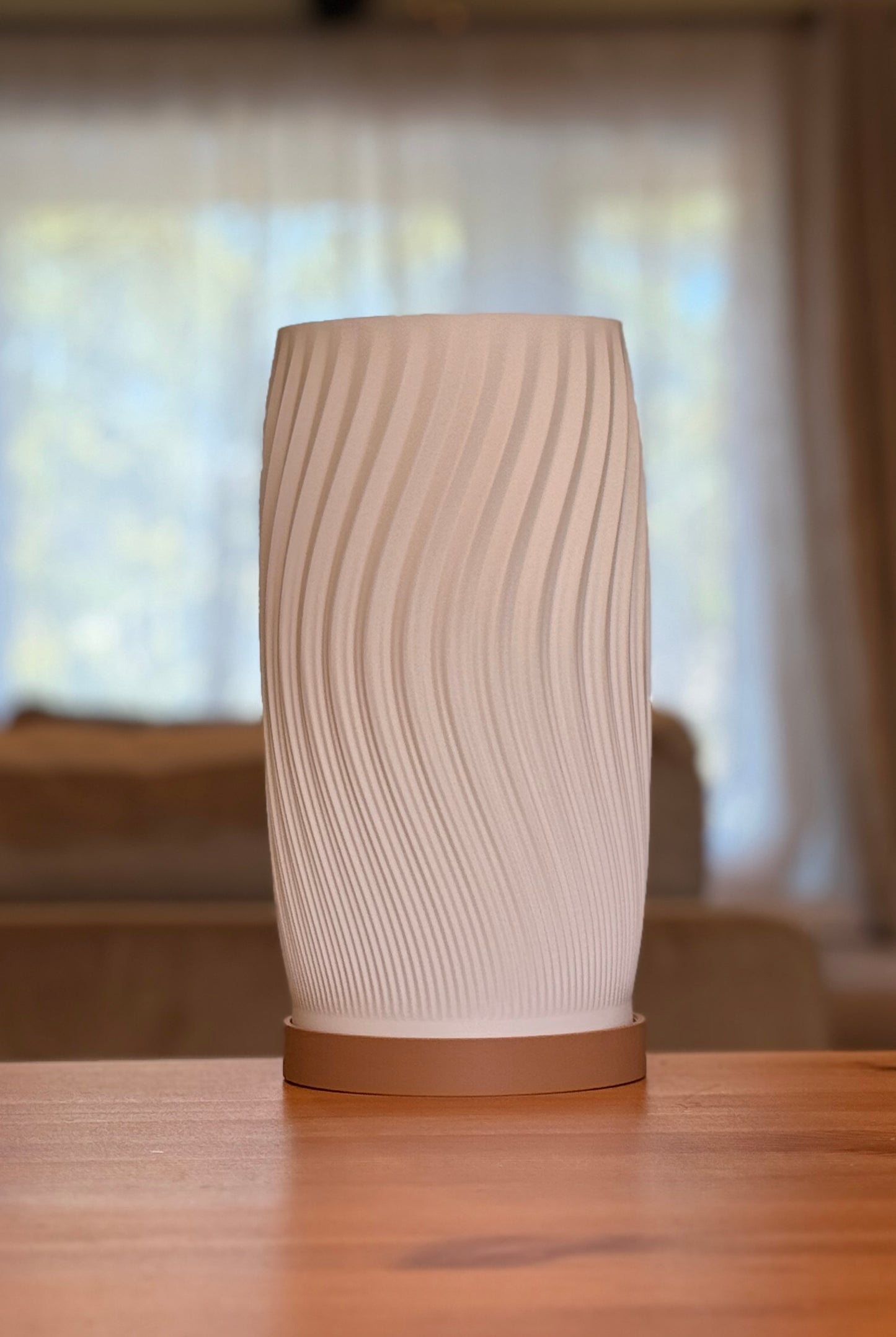 Modern Flow Curve Lamp featuring smooth flowing lines and warm light