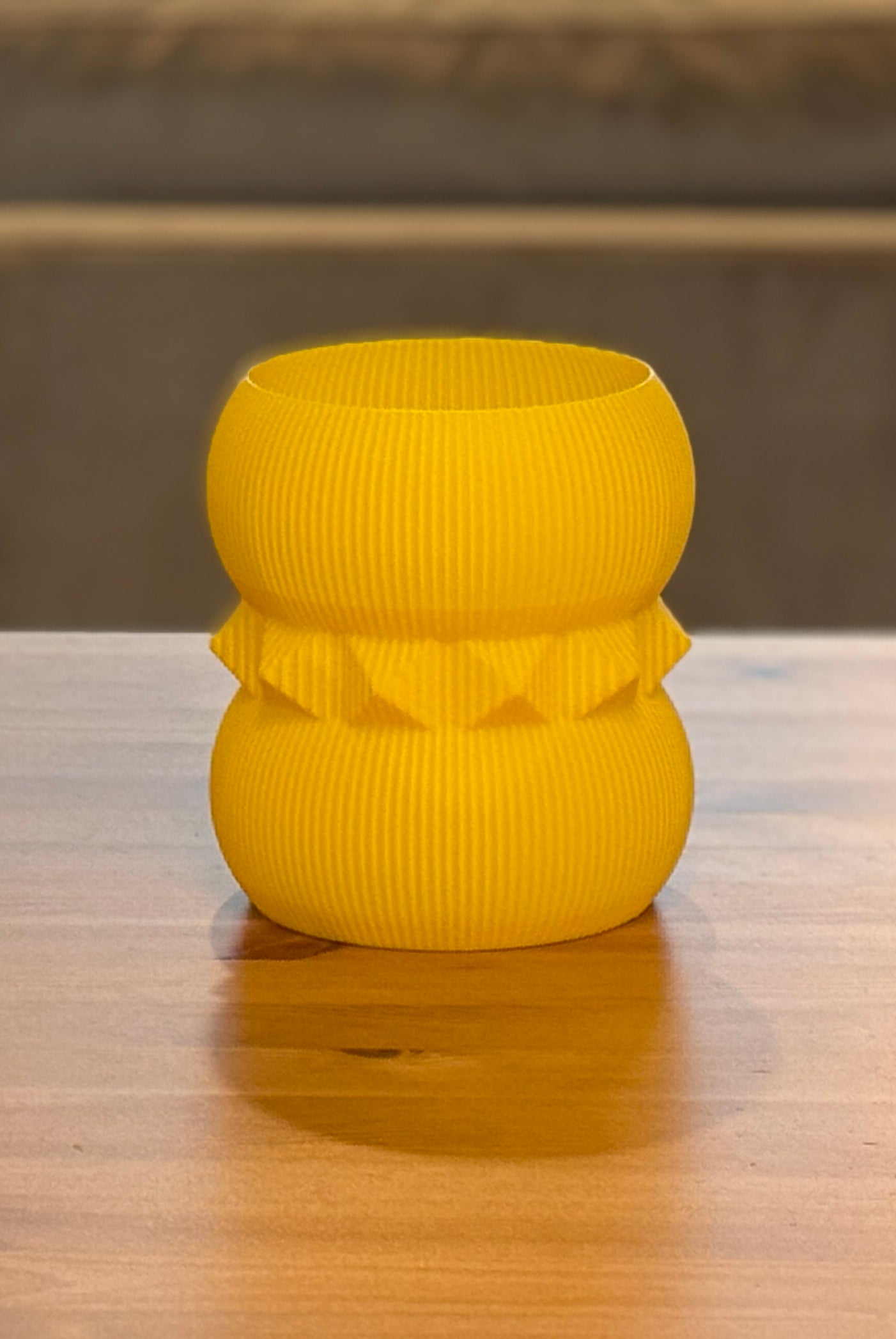 Henrietta planter displayed with houseplant in contemporary setting