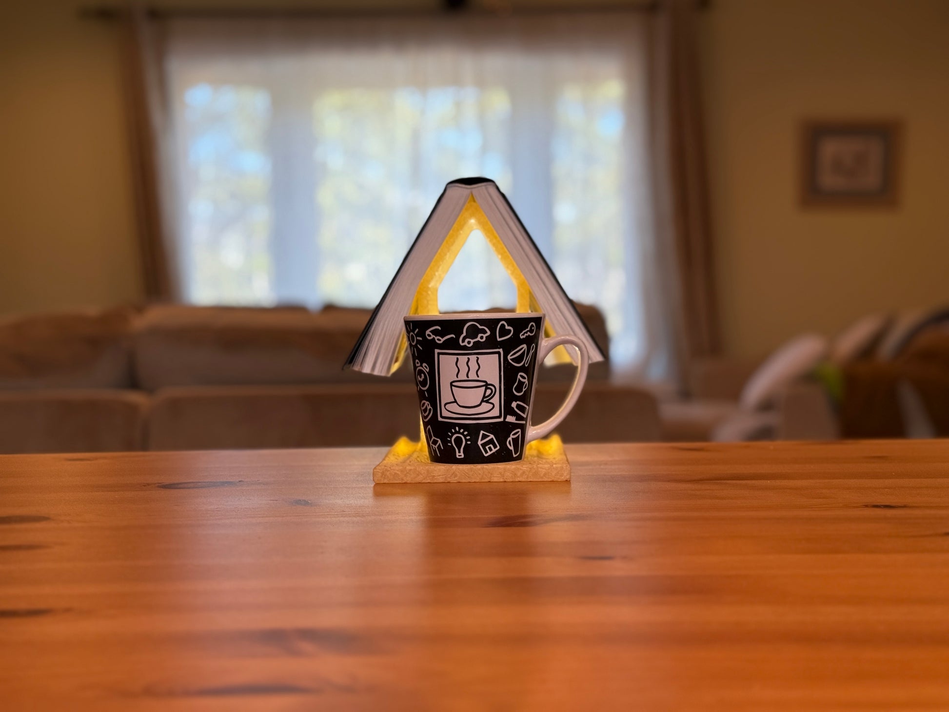 Cozy reading lamp with architectural book-stack design and warm illumination