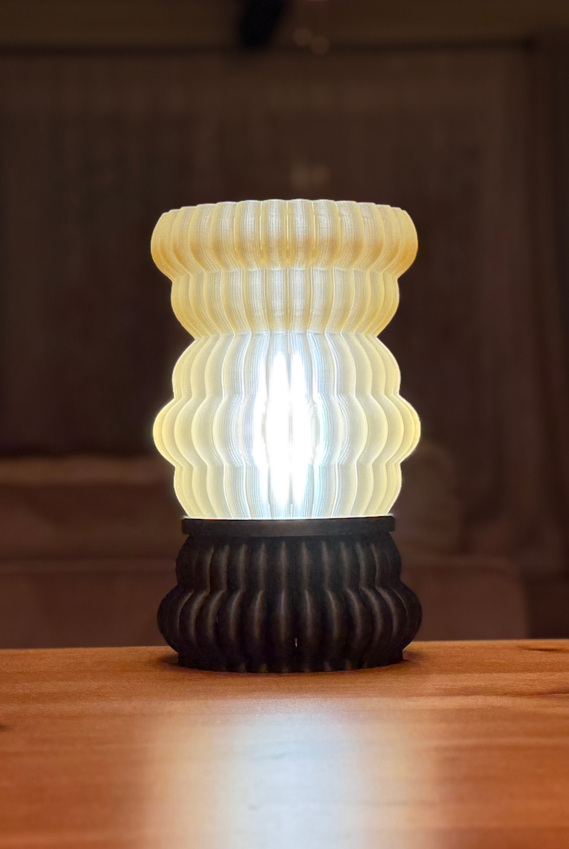 Leña Lamp used as a modern sculptural table lamp in a cozy interior