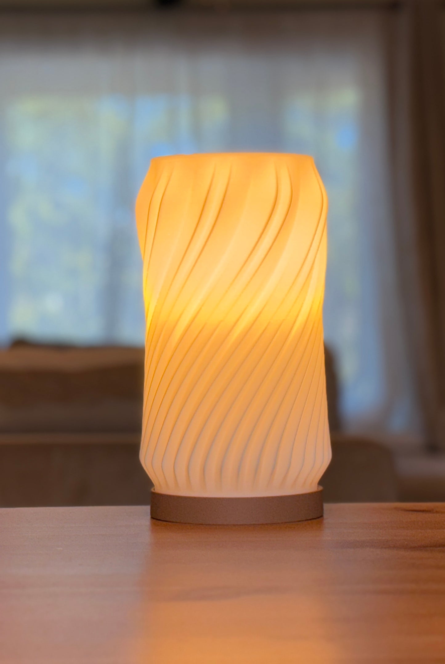 Minimalist spiral lamp used as ambient lighting in a contemporary interior.