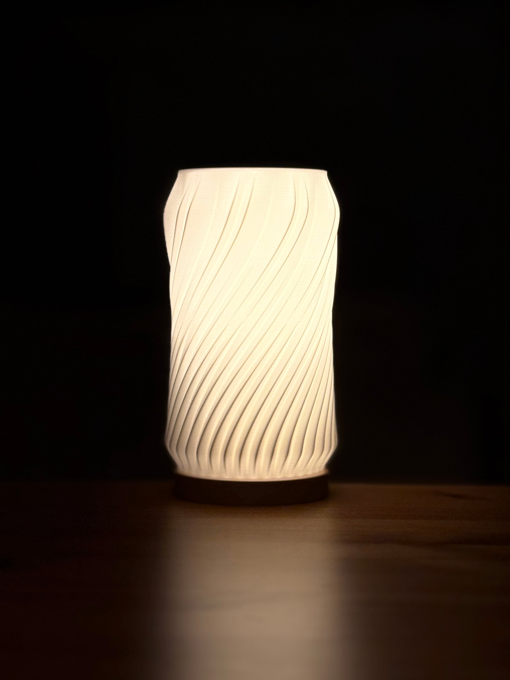 Sculptural minimalist spiral lamp showcasing clean lines and modern design.