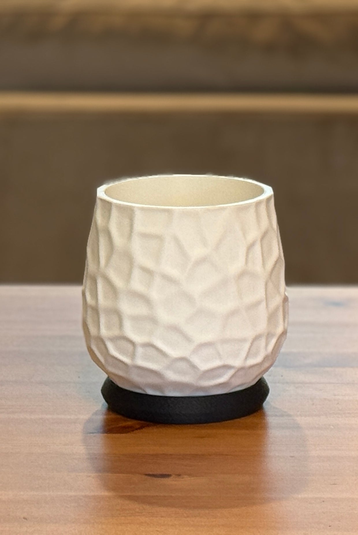 Nido planter and saucer set displayed with indoor plant on wooden surface