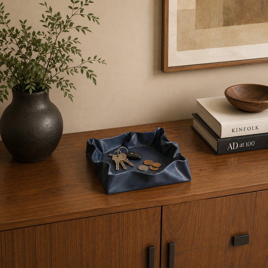 Puffy Valet Organizer displayed on a wooden credenza with everyday essentials, adding modern style and organization.
