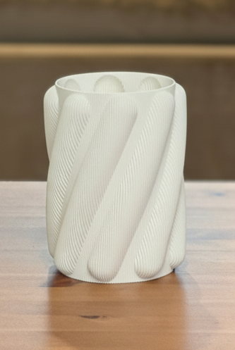 Modern Spaghetti planter displayed with houseplant in contemporary setting