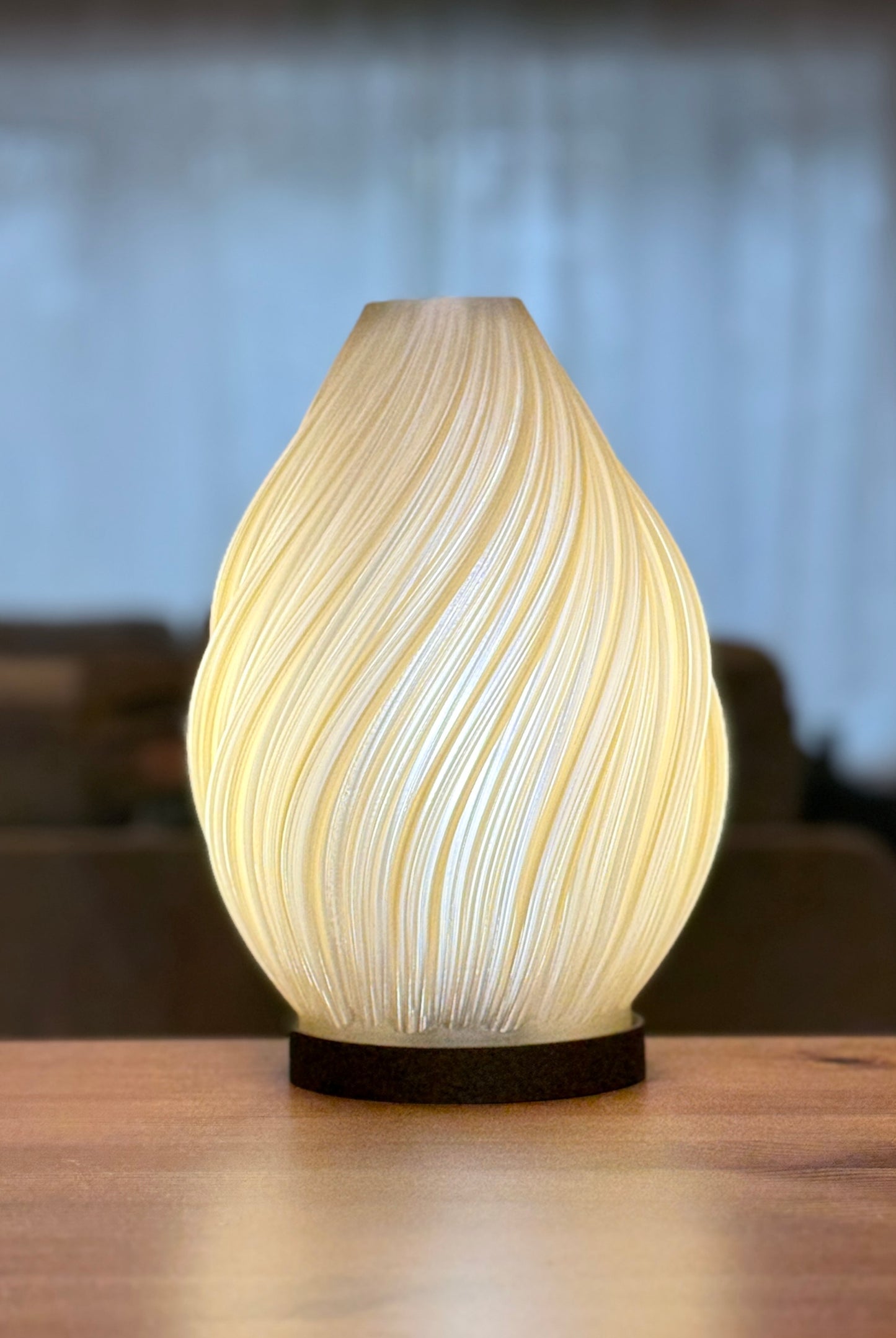 Modern Spiral Flame Lamp casting soft warm light on tabletop