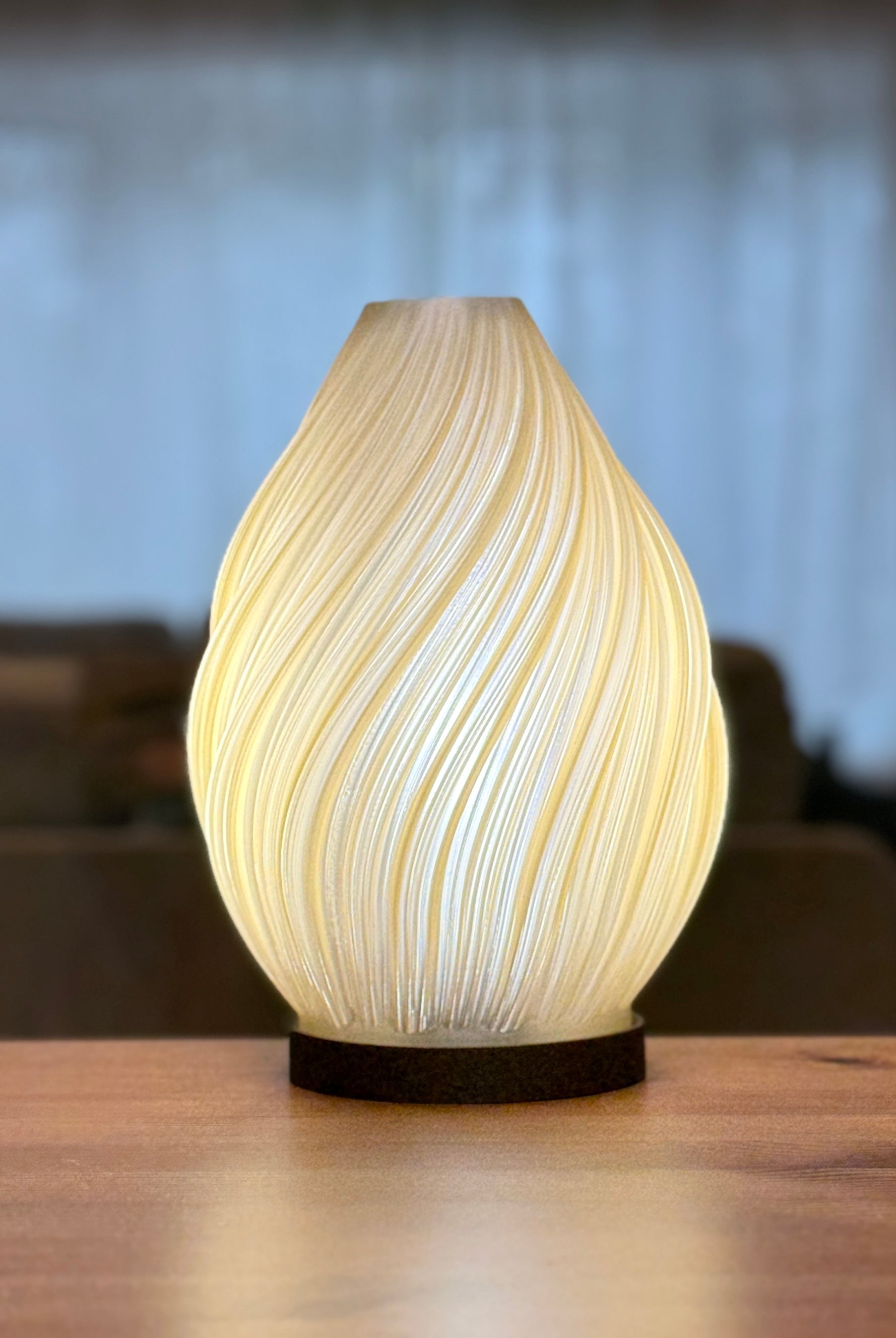 Modern Spiral Flame Lamp casting soft warm light on tabletop