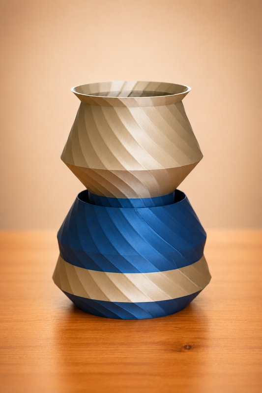 Stacker vase with layered sculptural design in metallic gold and blue finish, modern decorative vase for shelves and tabletops.
